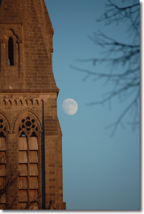 The Moon beside the spire of the Gunne Chapel in Maynooth